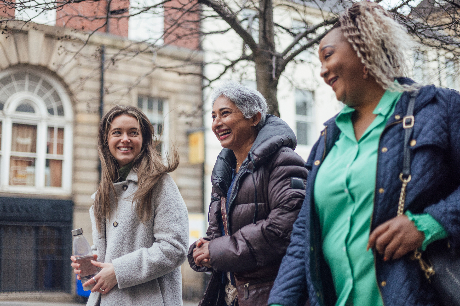 Three women walking together outdoors